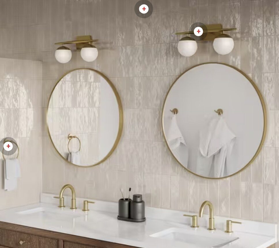 Reference photo of warm cream glazed vertical tile behind a double vanity with round mirrors