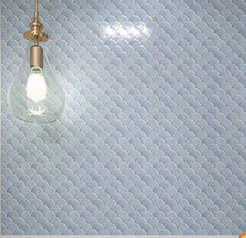 Soft blue scalloped tile selected for the laundry room backsplash at 5507 E Pinchot