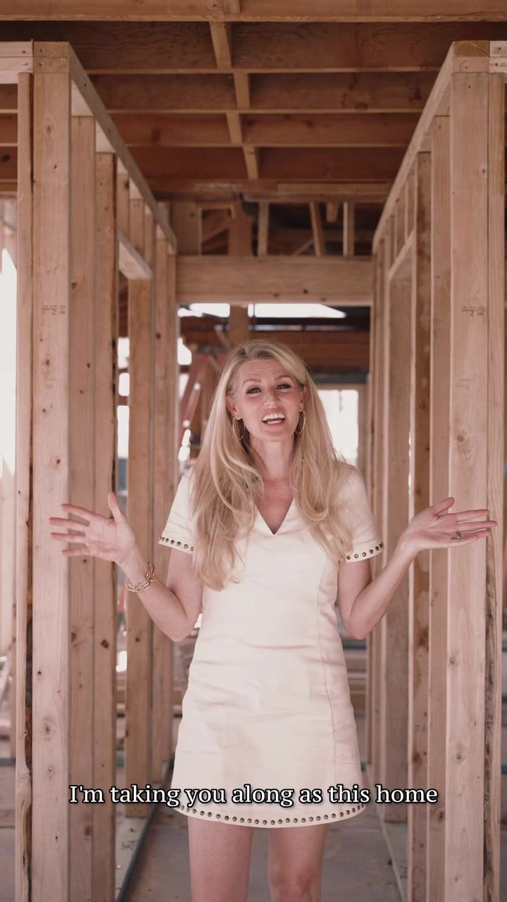 Meredith Lane standing in a framed hallway at 5507 E Pinchot, a new build in Arcadia Osborn