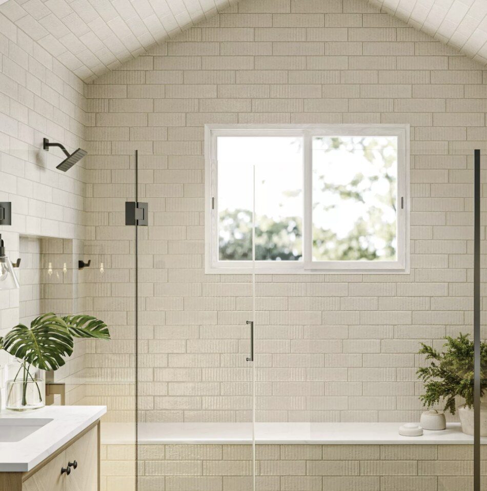 Reference photo of a walk-in shower with light fluted wall tile and a black-framed glass door
